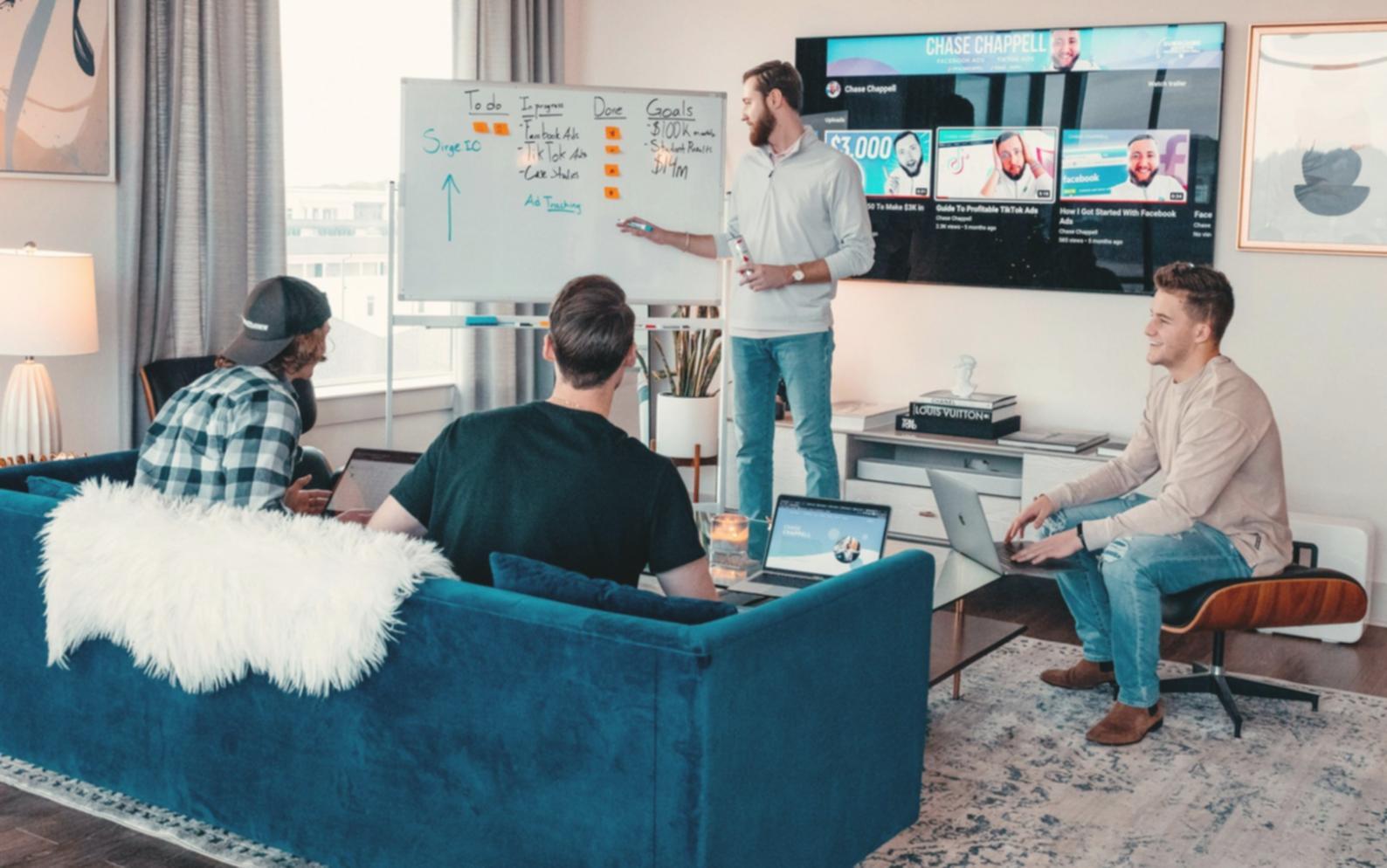 Workshop participants collaborating on financial planning exercises in modern learning environment