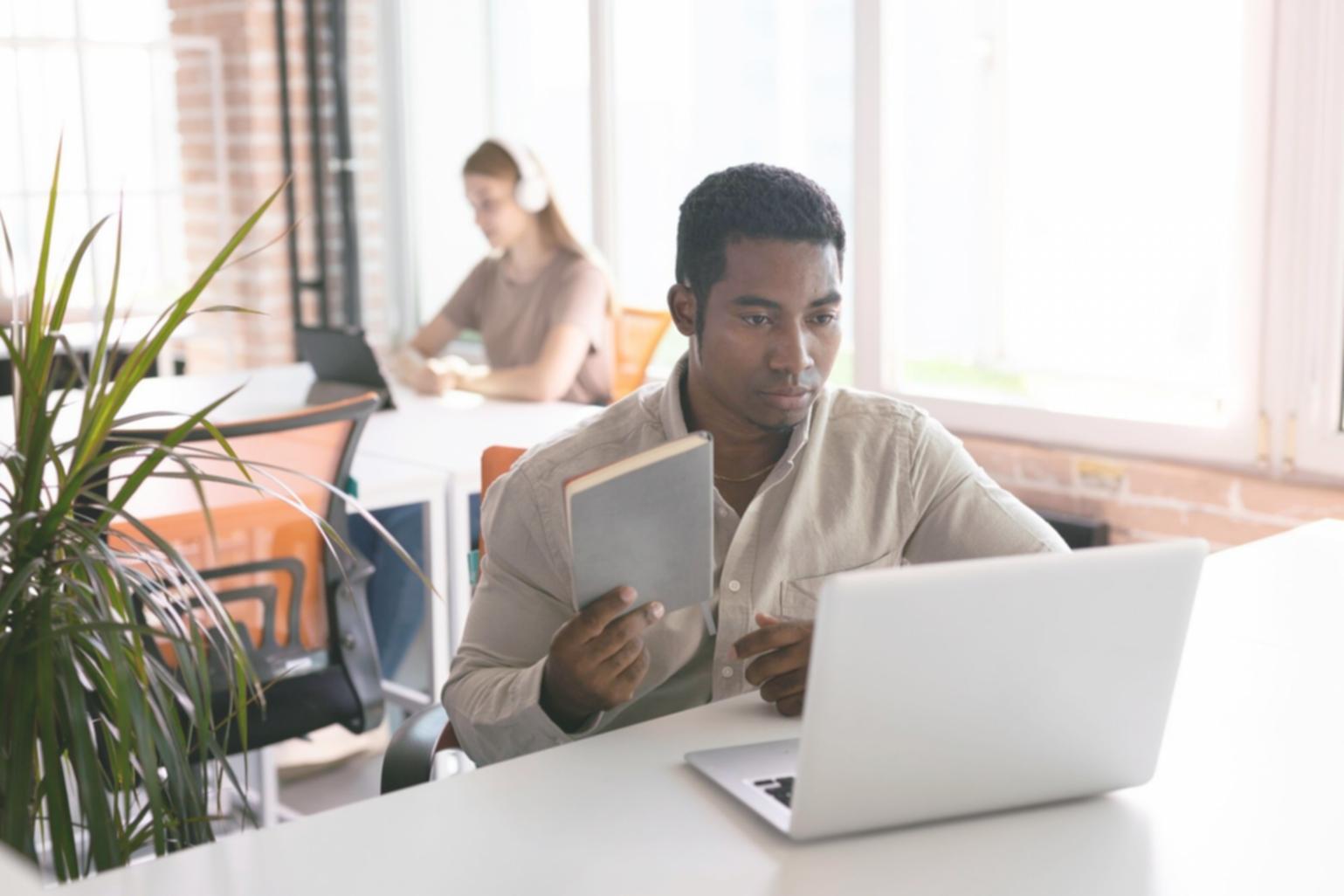 Financial planning workspace with notebooks and documents